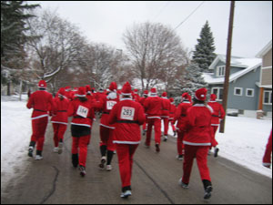 <image:The santas running;