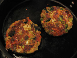 <image: The veggie patties cooking>